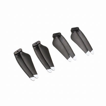 Four black LIMITLESS 5 drone propellers with white tips arranged diagonally on a plain white background.